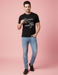 Man wearing a black t-shirt with text on a pink background