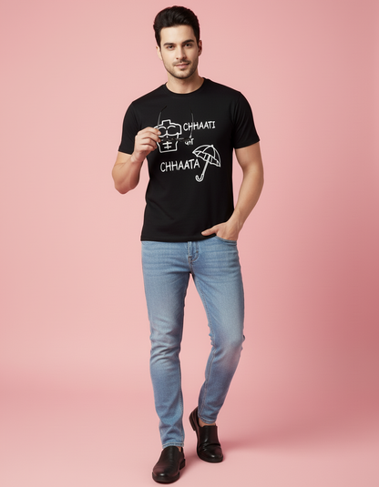 Man wearing a black t-shirt with text on a pink background