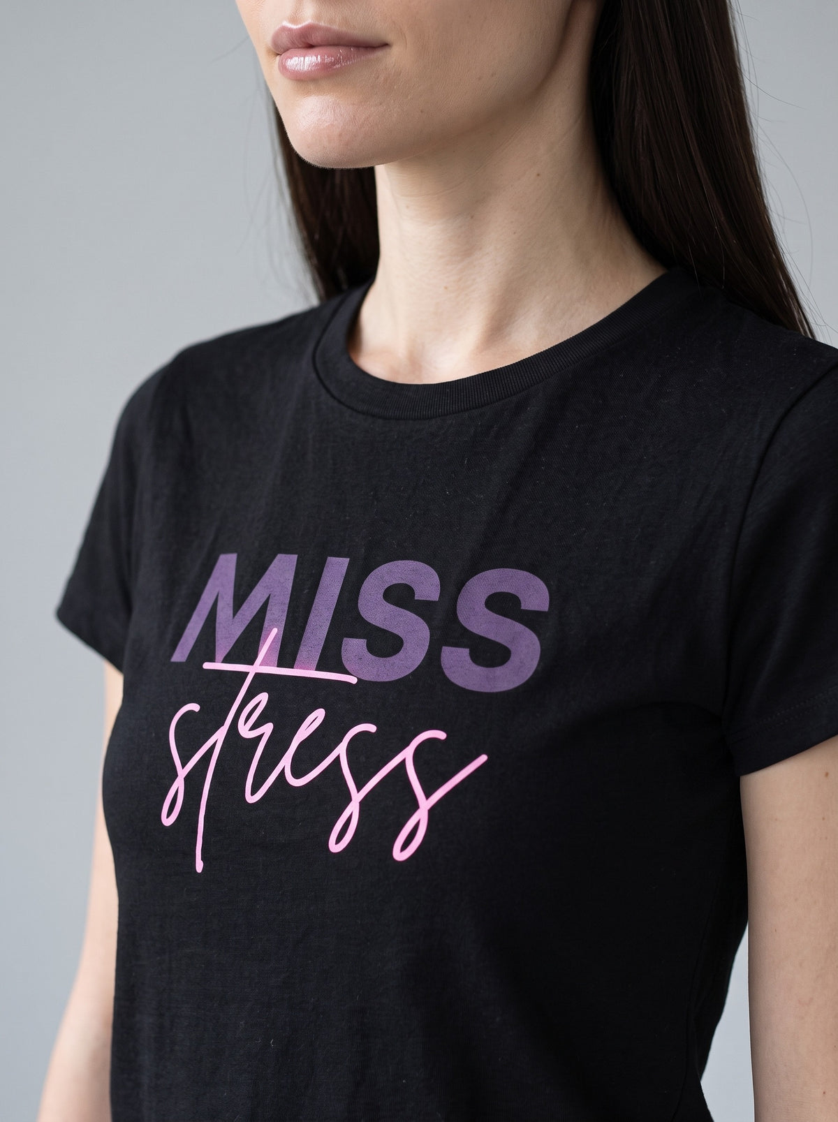 Miss Stress tee in Black — angled close-up [kk-studio]