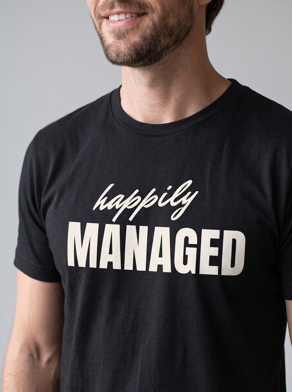 Happily Managed tee in Black — angled close-up [kk-studio]