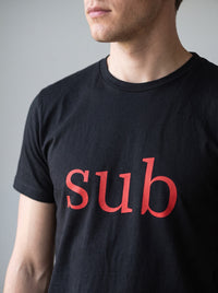 Sub tee in Black — angled close-up [kk-studio]