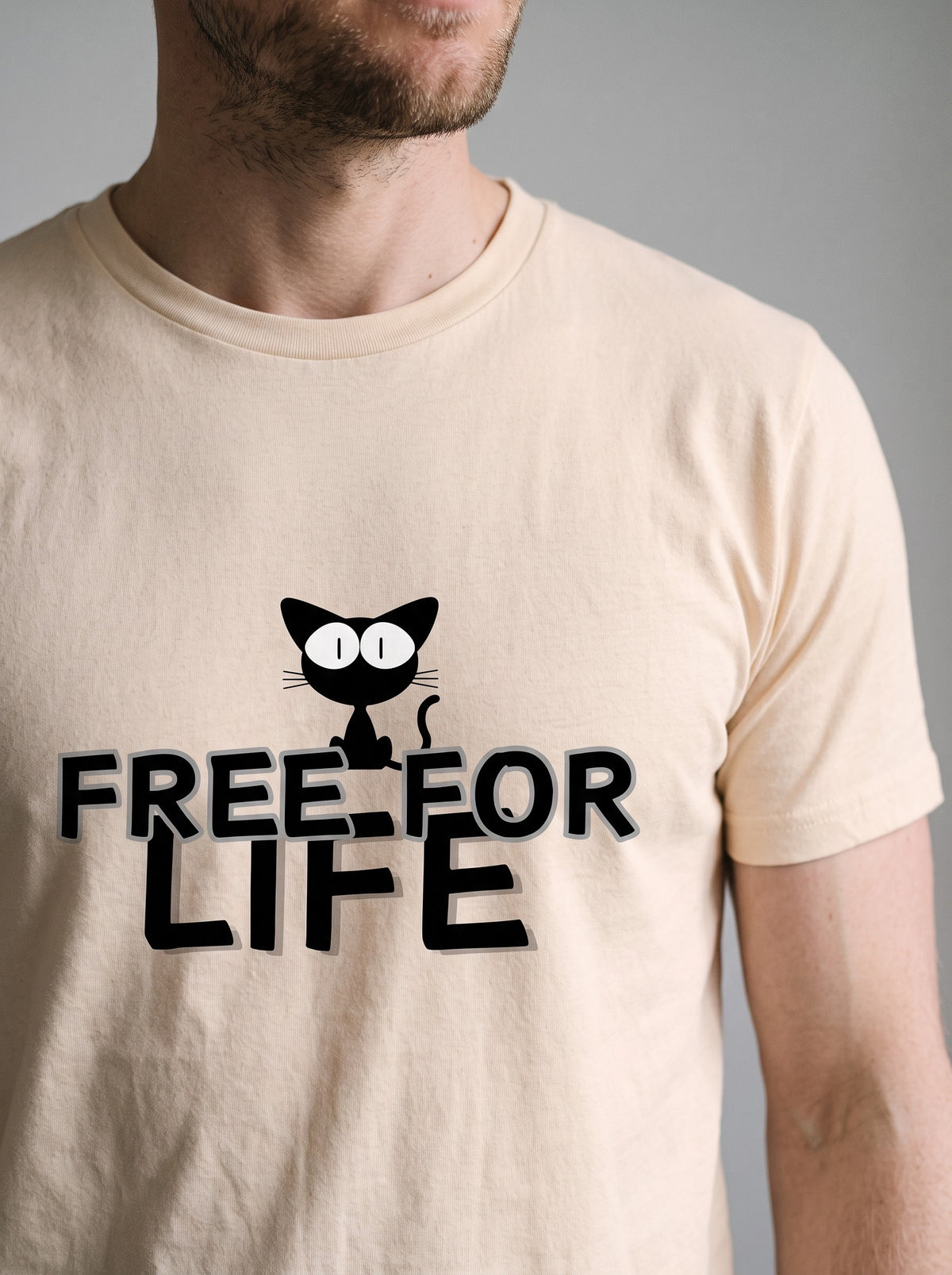 Free For Life tee in Soft Cream — angled close-up [kk-studio]