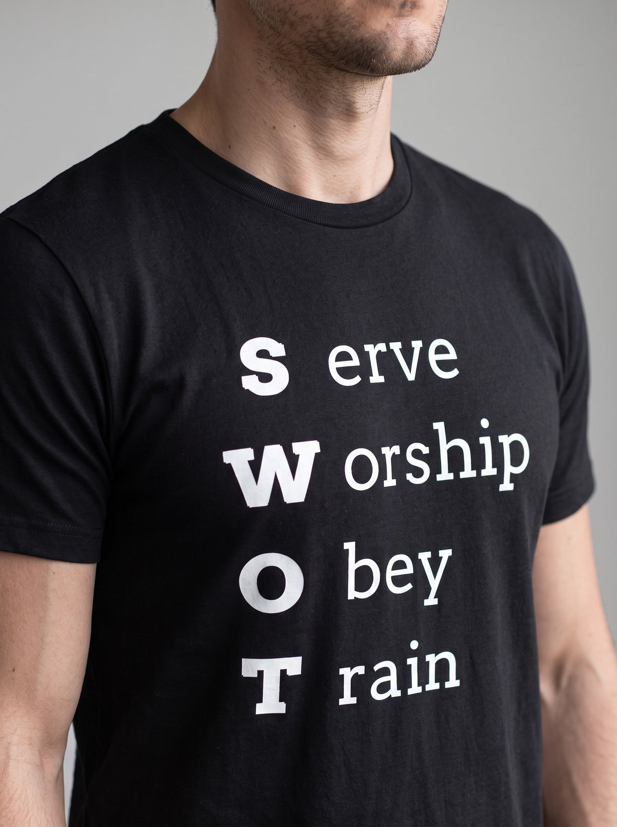 SWOT tee in Black — angled close-up [kk-studio]