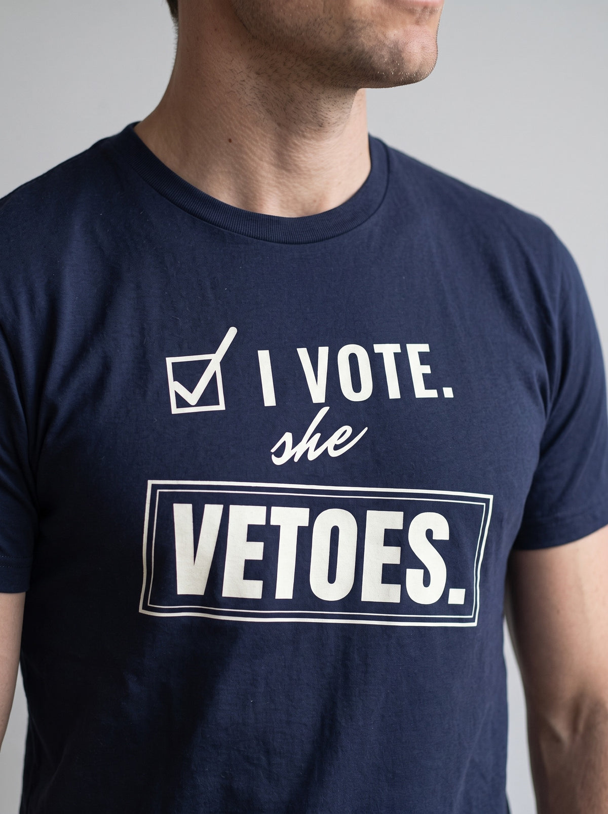 I Vote. She Vetoes. tee in Navy — angled close-up [kk-studio]