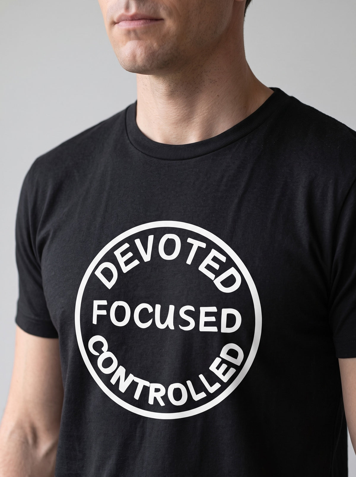 Devoted, Focused, Controlled tee in Black — angled close-up [kk-studio]