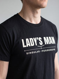 Lady's Man tee in Black — angled close-up [kk-studio]