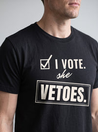 I Vote. She Vetoes. tee in Black — angled close-up [kk-studio]