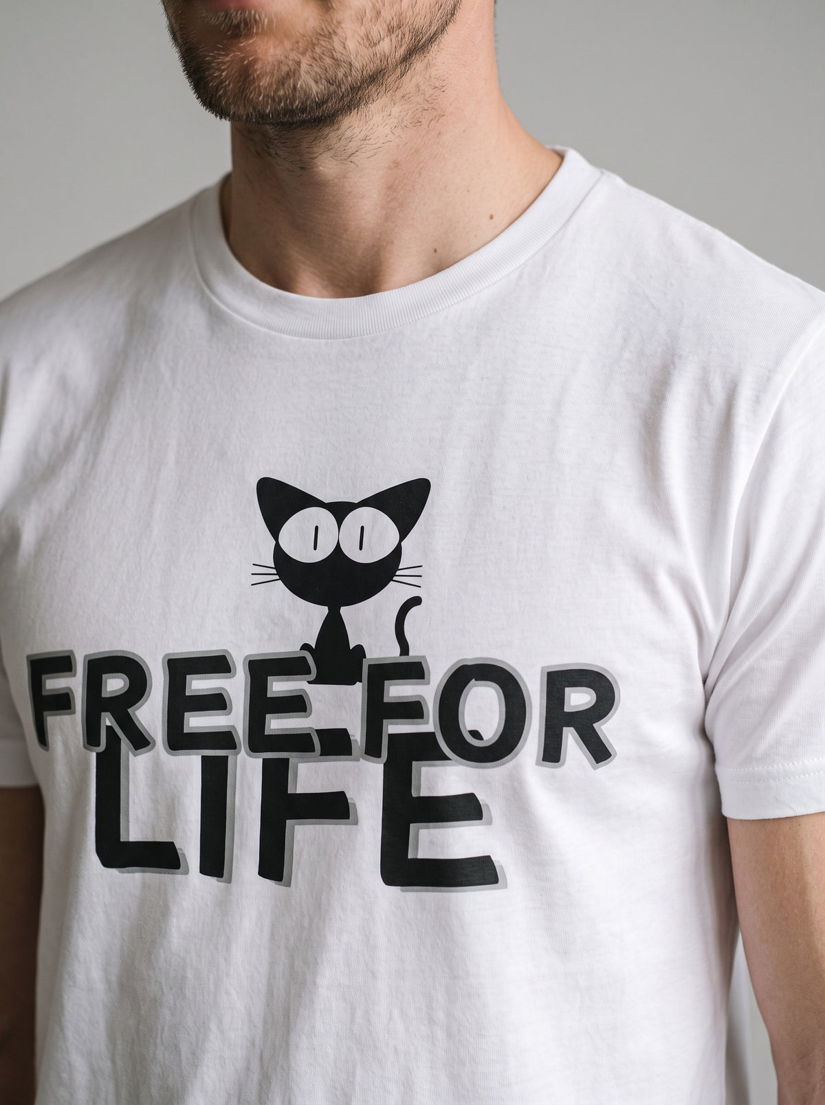 Free For Life tee in White — angled close-up [kk-studio]