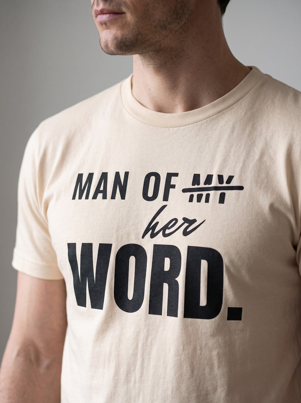 Man of Her Word tee in Soft Cream — angled close-up [kk-studio]