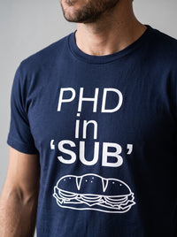 PhD in Sub tee in Navy — angled close-up [kk-studio]