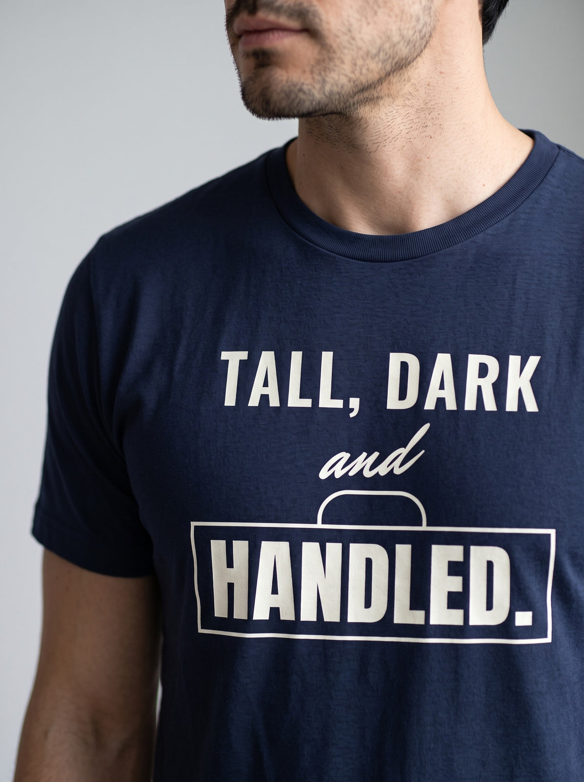 Tall, Dark and Handled tee in Navy — angled close-up [kk-studio]