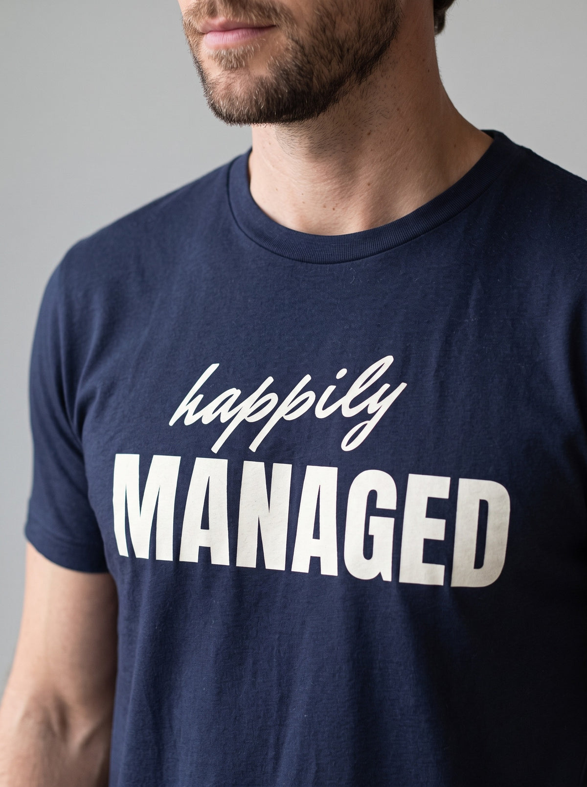 Happily Managed tee in Navy — angled close-up [kk-studio]