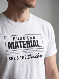 Husband Material. She's the Tailor. tee in White — angled close-up [kk-studio]