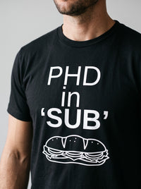PhD in Sub tee in Black — angled close-up [kk-studio]