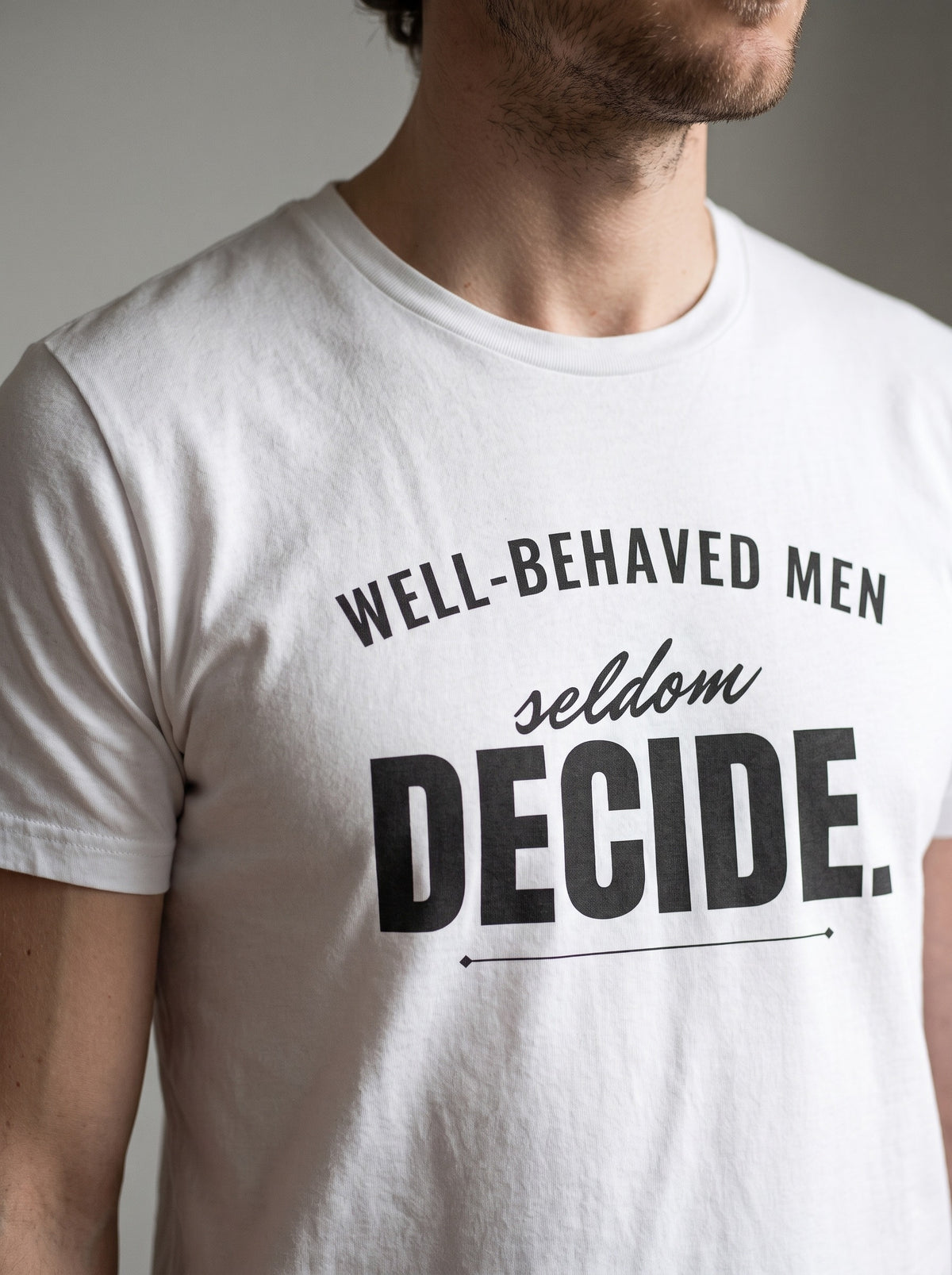 Well-Behaved Men Seldom Decide tee in White — angled close-up [kk-studio]