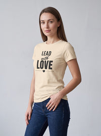 Lead With Love tee in Soft Cream — three-quarter view [kk-studio]