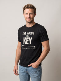 She Holds the Key tee in Black — three-quarter view [kk-studio]